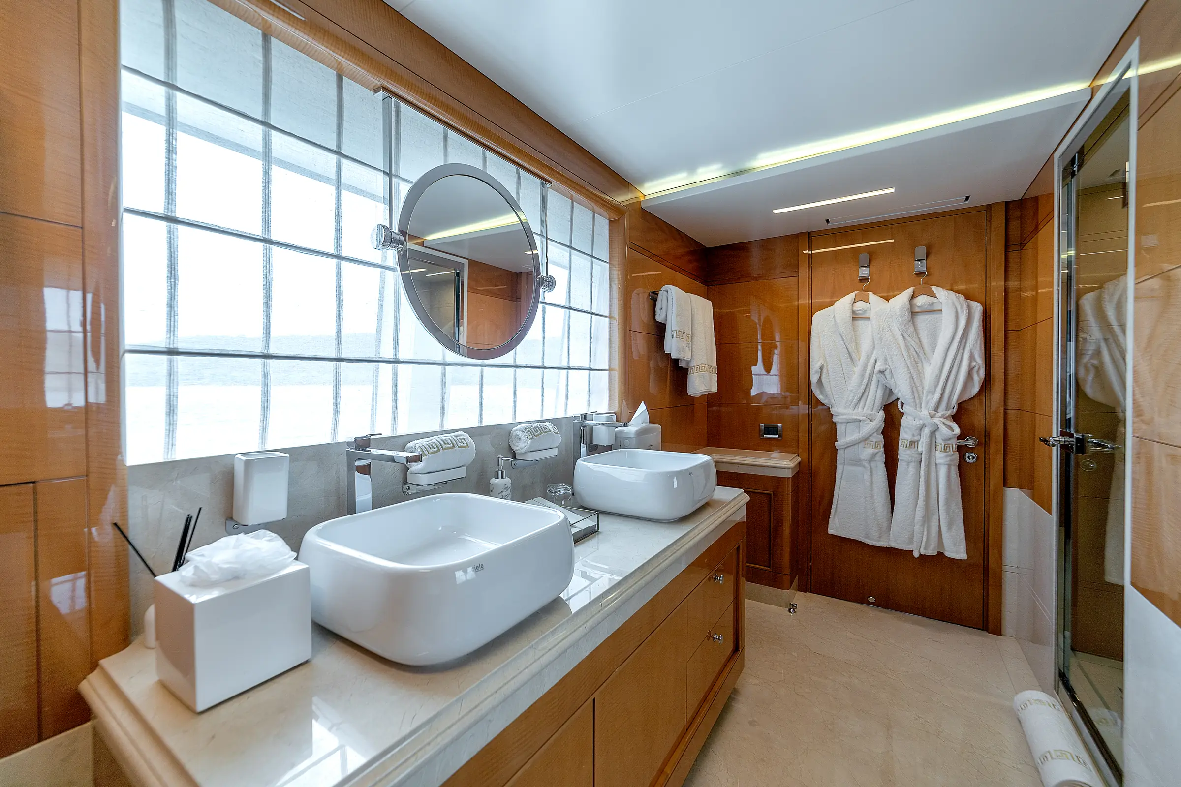 An ensuite bathroom, with twin basins and a walk-in shower