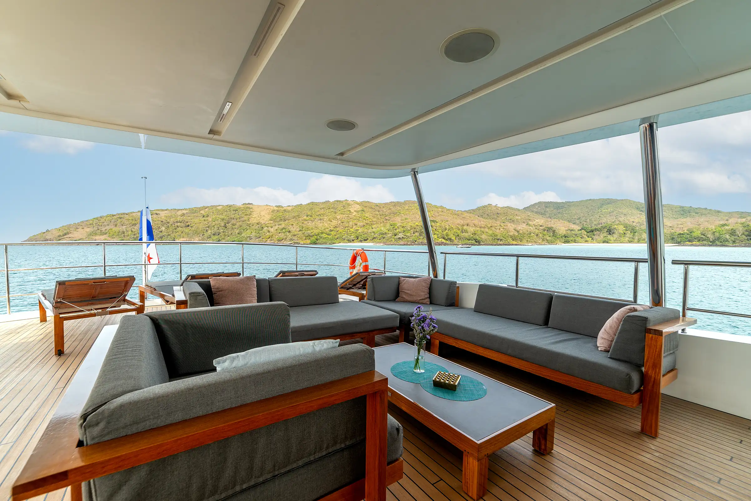 Teak sofas on the aft upper deck