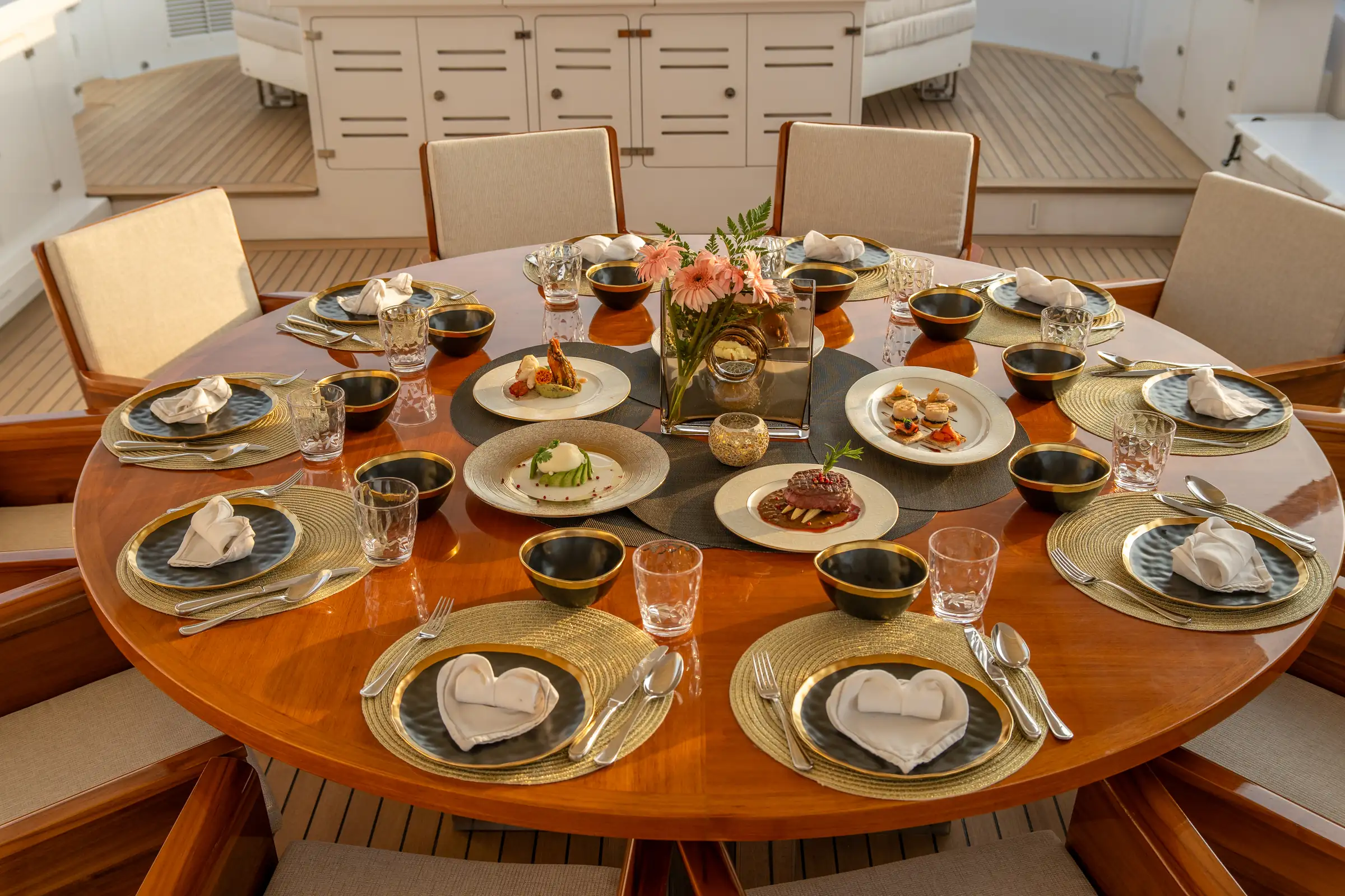 A round table laid for dinner, seen from above