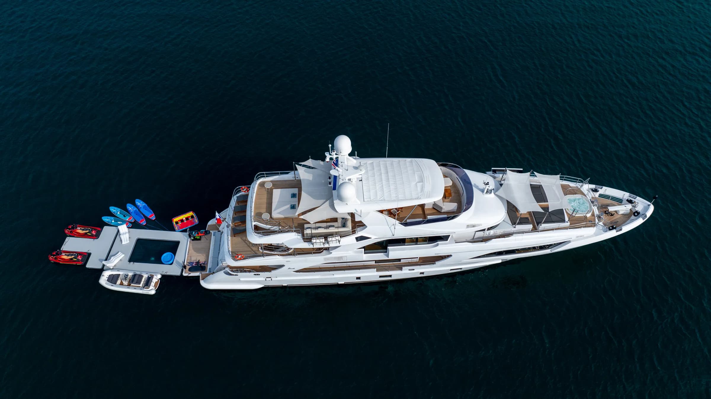 Asia Poseidon at anchor from above, her toys in the water