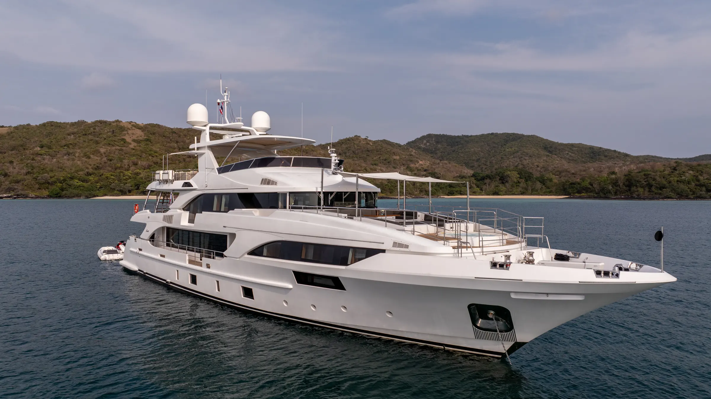 Asia Poseidon in full starboard profile, at anchor