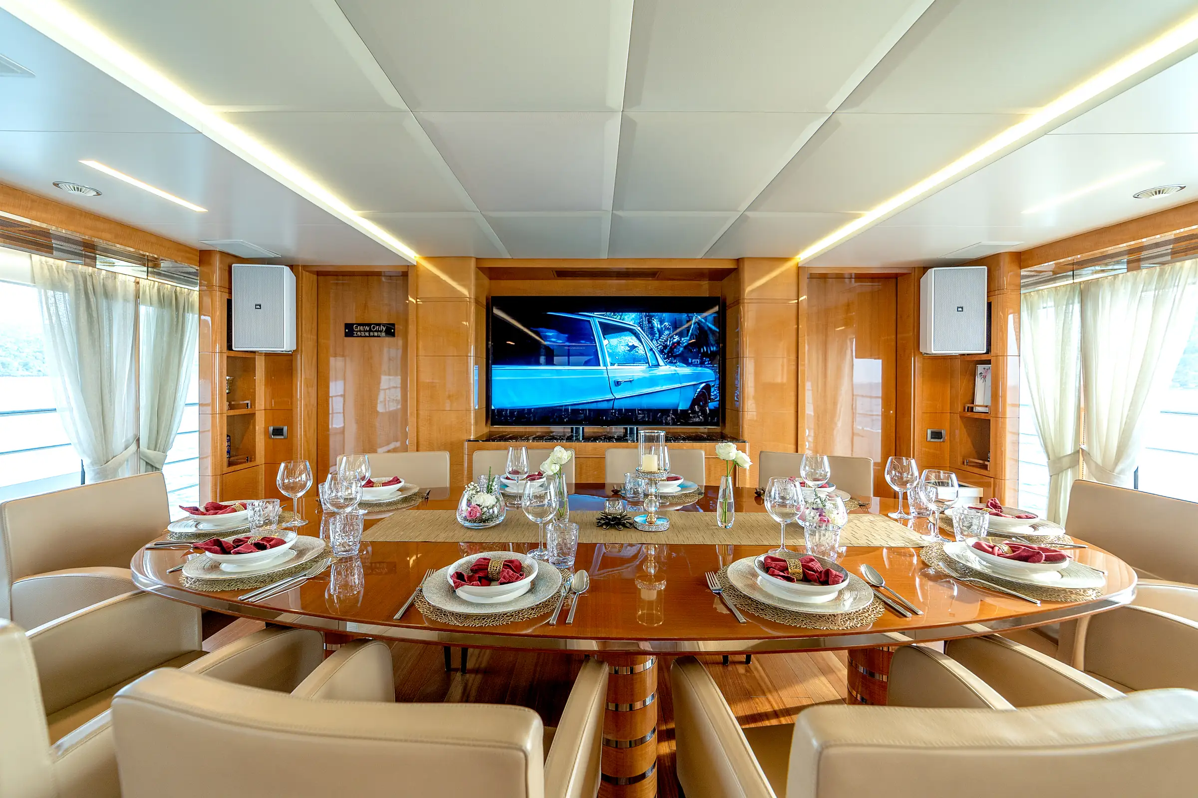 The salon dining table, laid, with the screen behind